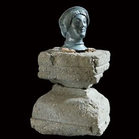 null - Female bronze head on a stone base

