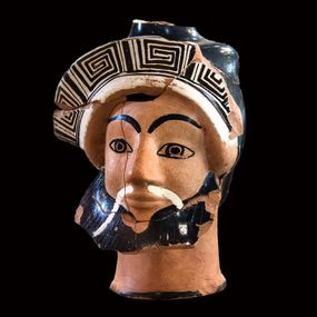 null - Jug (oinochoe) in the shape of a head of dionysus