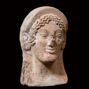 null - Female votive head in terracotta

