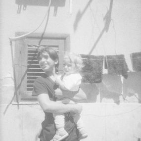 [object Object] - Boy with baby in her arms
