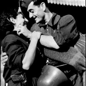 Robert Capa - Bidding farewell before gettin on a military train directed to the Aragon front Spain