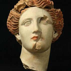 null - Female head in polychrome terracotta