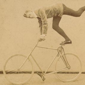 [object Object] - Acrobat in tightrope walk on a bicycle