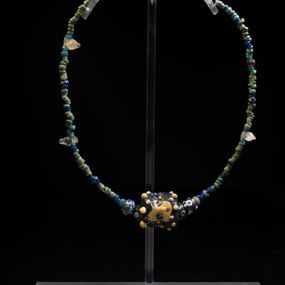 null - Glass paste necklace of Phoenician-Punic type, from tomb 604