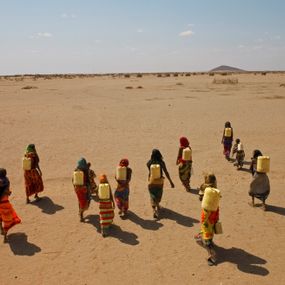 [object Object] - Women of the Gabra ethnic group carry cans to Kenya