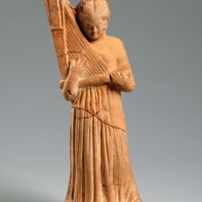 null - Figurina fittile di donna con arpa triangolare