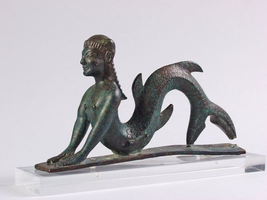 Marine figure in bronze, pertaining to the lining of chariots
