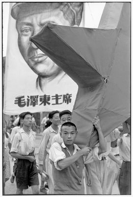 Henri Cartier-Bresson - Parade of students, with a portrait of Mao Zedong and the red star.