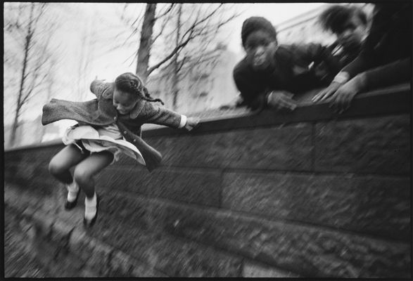 Mary Ellen Mark - Girl Jumping over a Wall