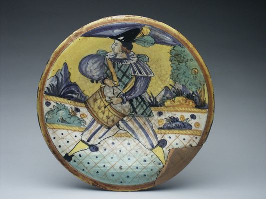 Ornamental plate with drum player