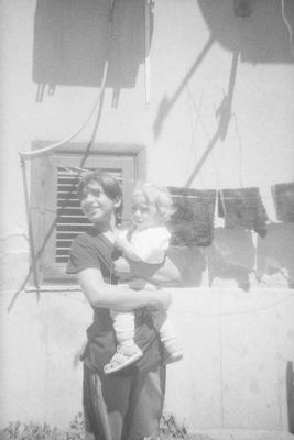 Ornella Mazzola; Andrea Petrosino - Boy with baby in her arms