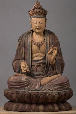 Bodhisattva seated in reverse vitarkamudrā