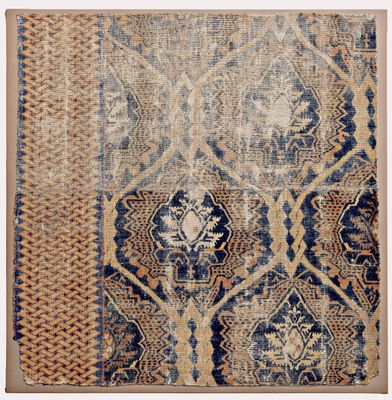 Fragment of a carpet with a textile pattern