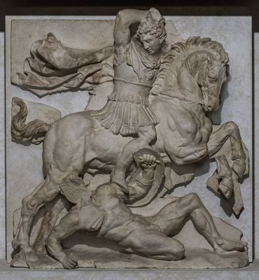 Metope decorated with naiskos with battle scene between Greeks and barbarians