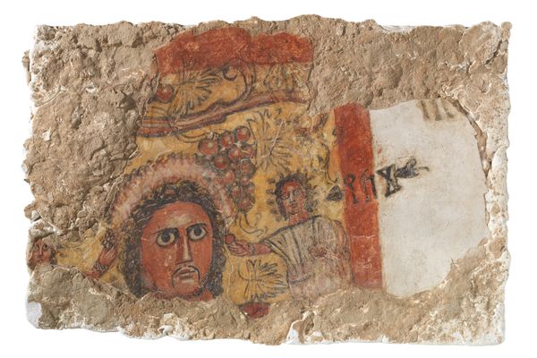 Fragment of wall painting with a virile head and ancient South Arabian inscription: banquet scene