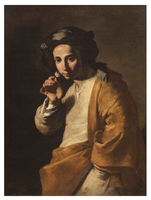Young man smelling a rose