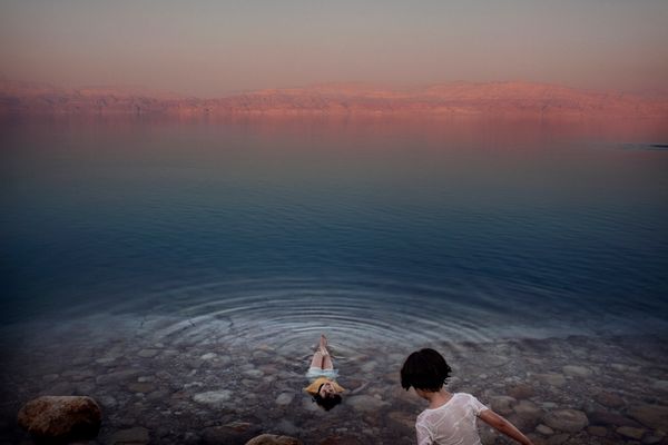 Paolo Pellegrin - Palestinian girls bathe in the waters of the Dead Sea