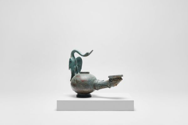 Bronze oil lamp with swan-shaped grip