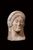 Female votive head in terracotta