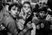 Letizia Battaglia - The children play with the weapons they received as a gift from their parents on November 2, Day of the Dead. Palermo